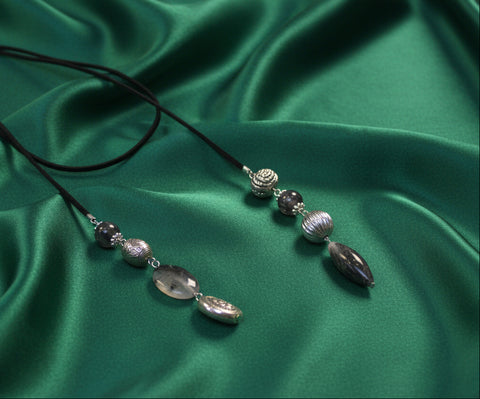 03122502BK Sleek black cord necklace with subtle metallic beads